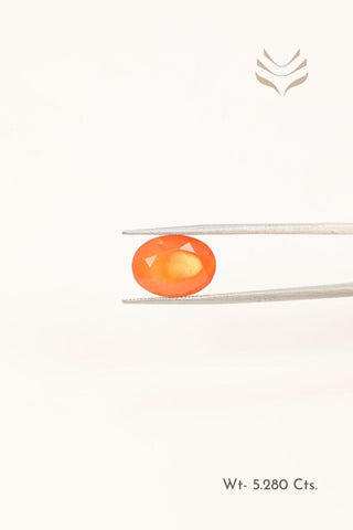 Vibrant Carnelian gemstone weighing 5.28 carats in an oval cut.